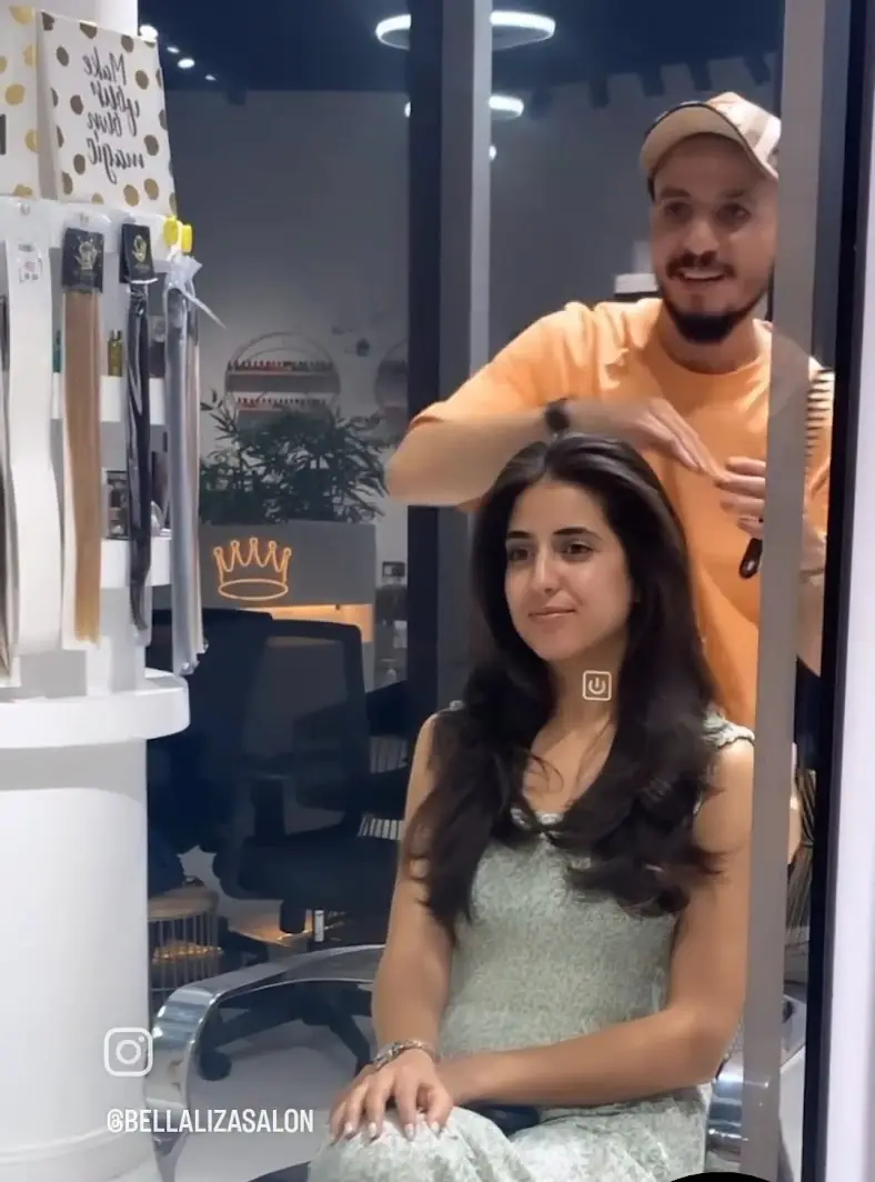 A client styled in the salon chair at Bellaliza