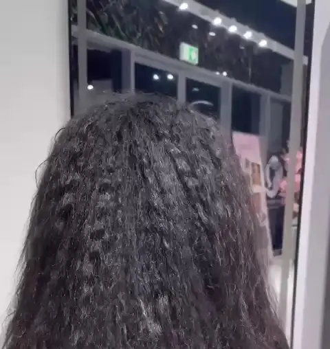 Crimped texture styling on long dark hair